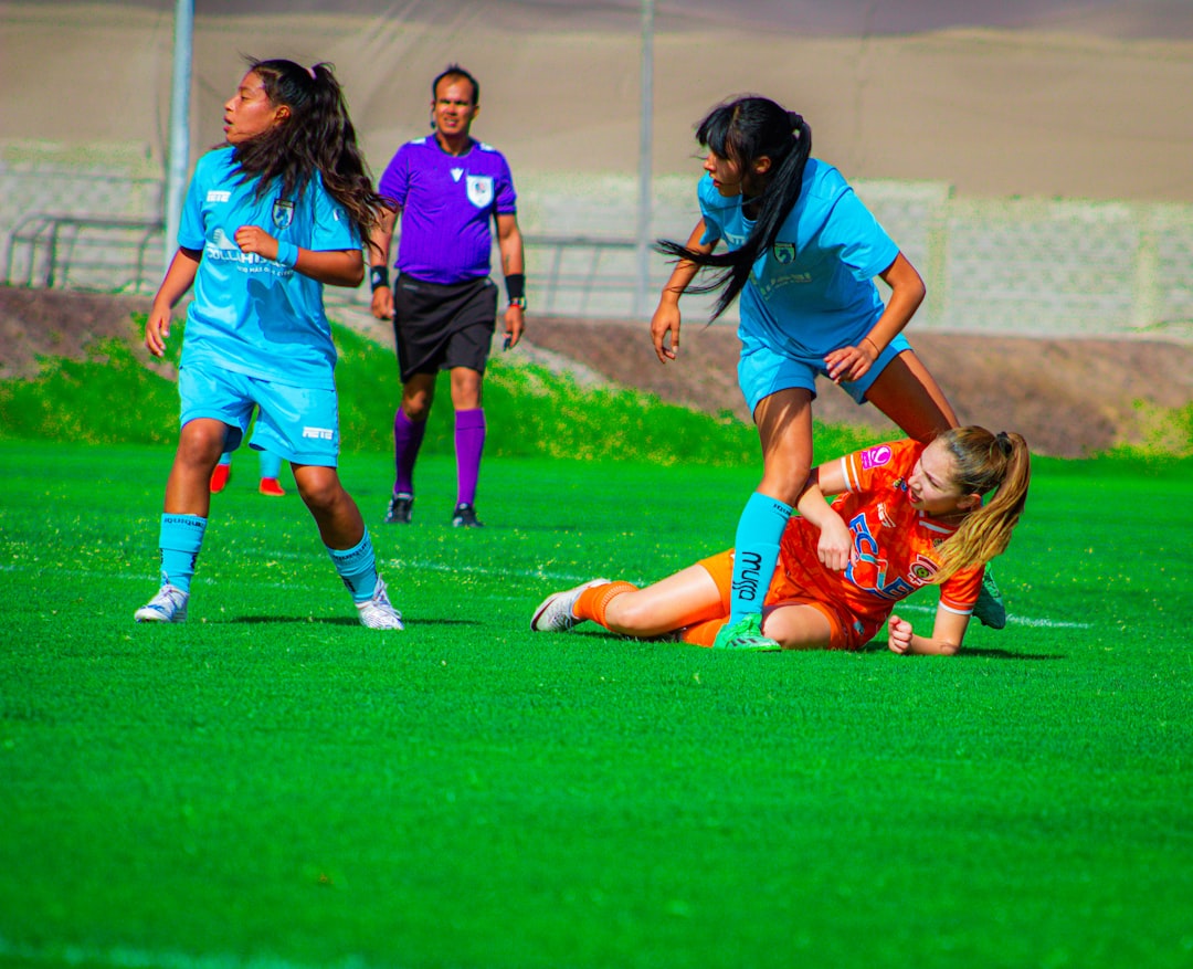 Soccer players are in an intense match on the field.