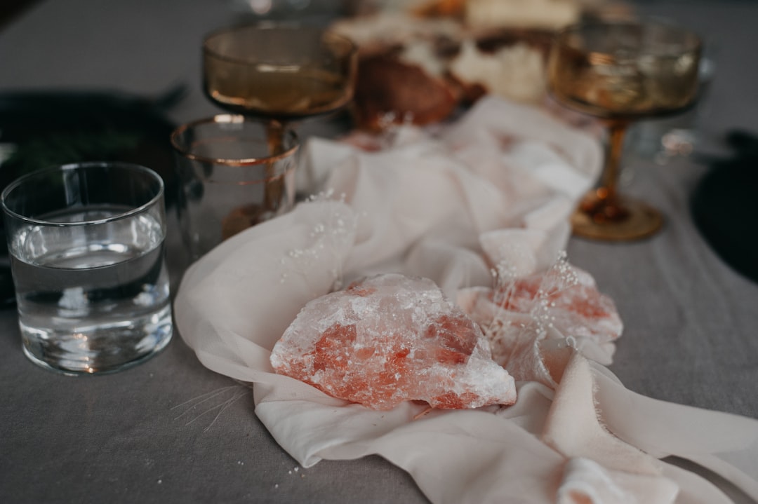a table topped with glasses filled with liquid